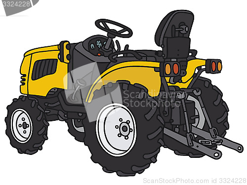 Image of Yellow small tractor