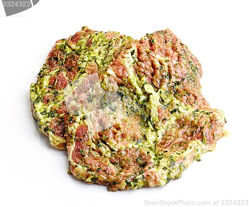 Image of raw meat cuts in green marinade