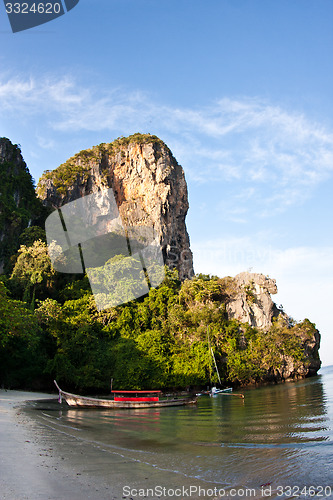 Image of Long tail boat  at the beach in Railay Beach Thailand and rock i