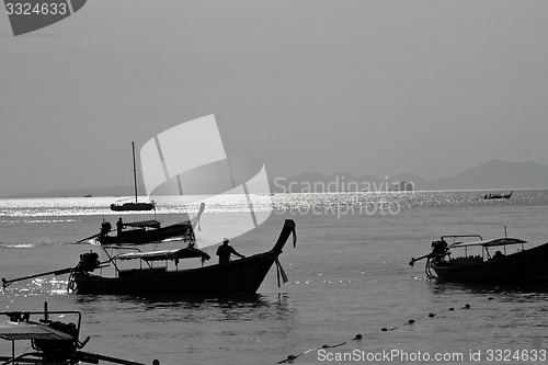Image of Silhouette of Long tail boat  in Railay Beach Thailand
