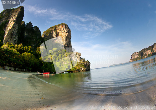 Image of Long tail boat  at the beach in Railay Beach Thailand and rock i