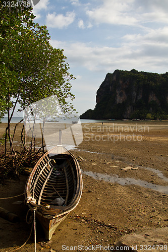 Image of Abandonned Long tail boat  in Railay Beach Thailand