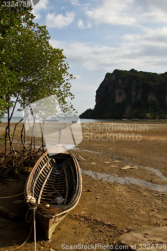 Image of Abandonned Long tail boat  in Railay Beach Thailand