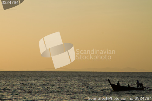 Image of Silhouette of Long tail boat  in Railay Beach Thailand at sunset