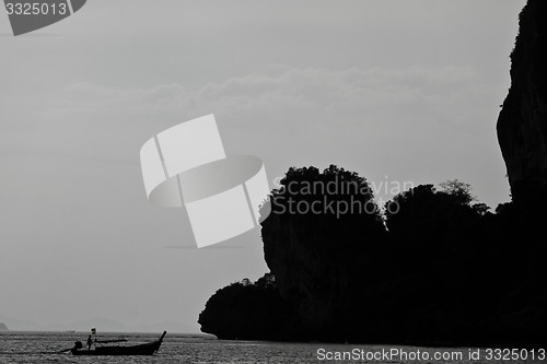 Image of Silhouette of Long tail boat  in Railay Beach Thailand