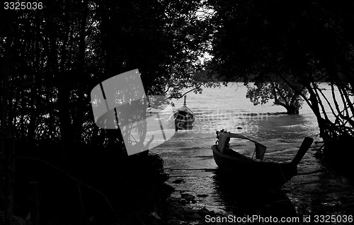 Image of Silhouette of Long tail boat  in Railay Beach Thailand