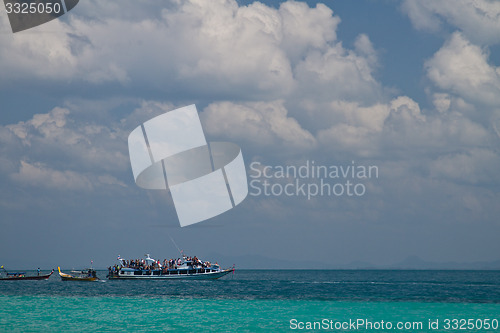 Image of Tourists on a boat  in thailand