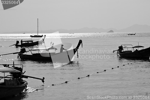 Image of Silhouette of Long tail boat  in Railay Beach Thailand