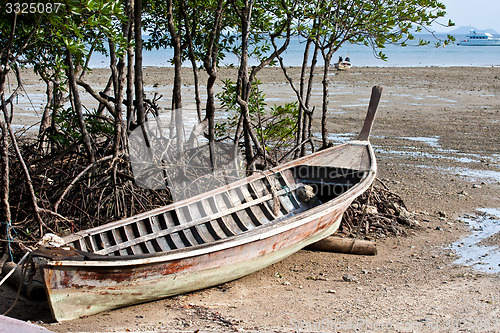 Image of Abandonned Long tail boat  in Railay Beach Thailand