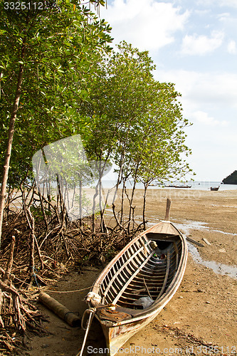 Image of Abandonned Long tail boat  in Railay Beach Thailand