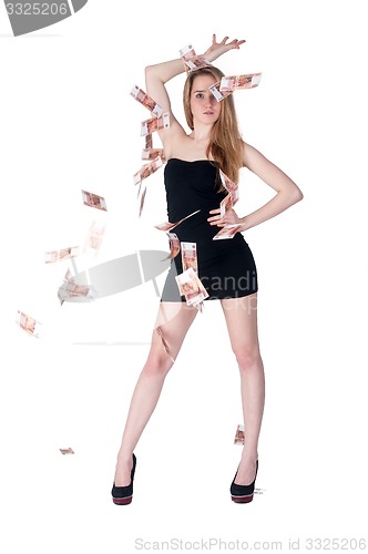 Image of Beautiful young lady among flying cash