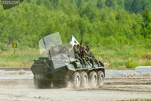 Image of BTR-82A armoured personnel carrier with soldiers