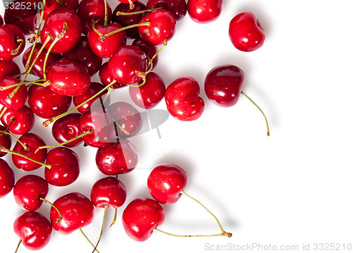 Image of Pours pile of juicy sweet cherries