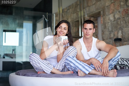 Image of couple relax and have fun in bed