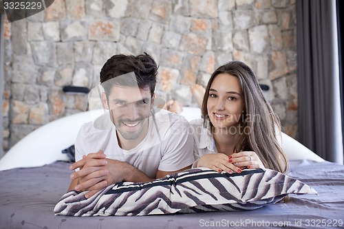 Image of couple relax and have fun in bed