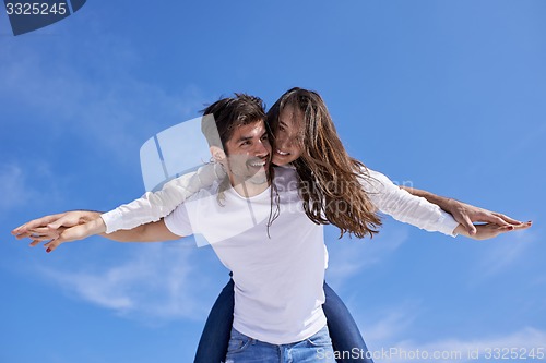Image of happy young romantic couple have fun arelax  relax at home