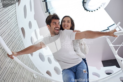 Image of relaxed yung couple at home  stairs