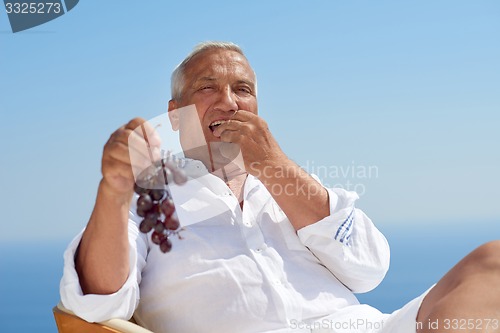 Image of senior man sitting outside