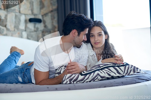 Image of couple relax and have fun in bed