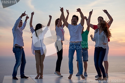 Image of party people  on sunset