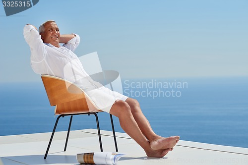 Image of senior man sitting outside