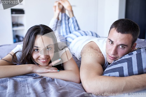 Image of couple relax and have fun in bed