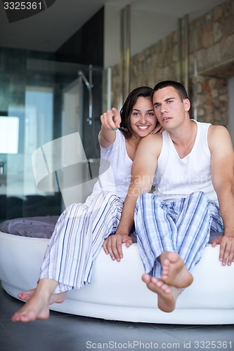 Image of couple relax and have fun in bed