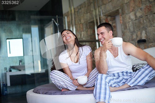 Image of couple relax and have fun in bed