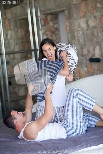 Image of couple relax and have fun in bed