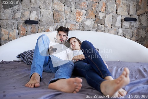 Image of couple relax and have fun in bed