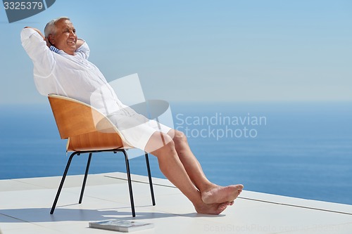 Image of senior man sitting outside