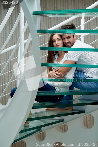 Image of relaxed yung couple at home  stairs