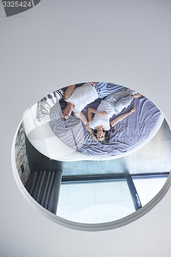 Image of couple relax and have fun in bed