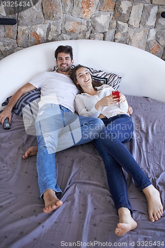 Image of couple relax and have fun in bed