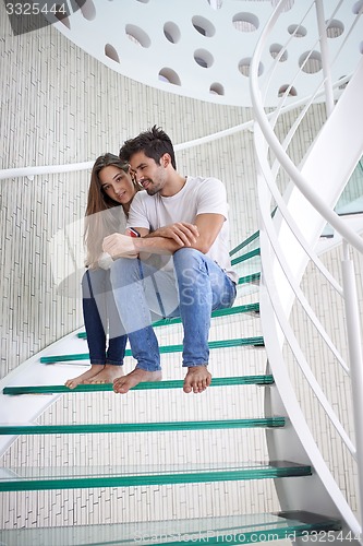 Image of relaxed yung couple at home  stairs