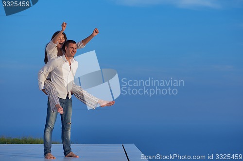 Image of happy young romantic couple have fun arelax  relax at home