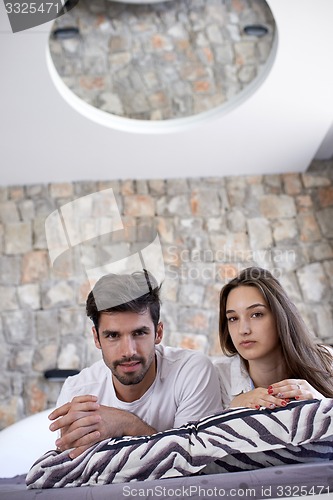 Image of couple relax and have fun in bed