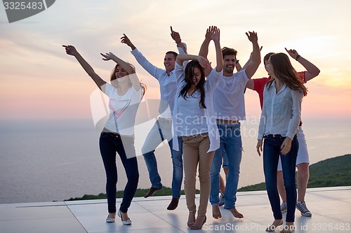 Image of party people  on sunset