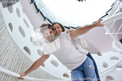 Image of relaxed yung couple at home  stairs