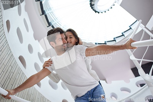 Image of relaxed yung couple at home  stairs