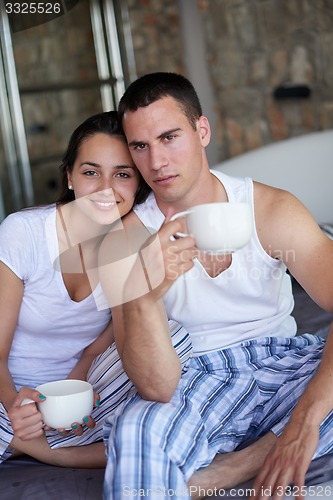 Image of couple relax and have fun in bed