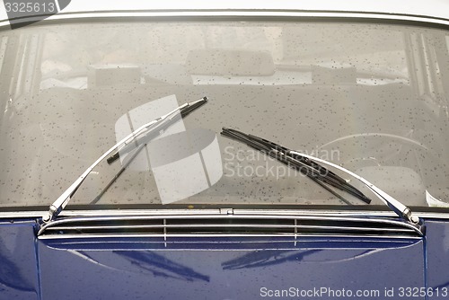 Image of  window with wipers of vintage car