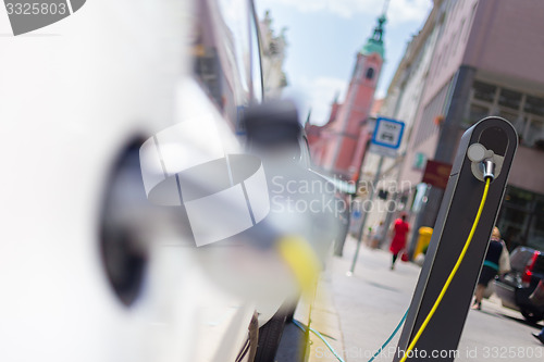 Image of Electric Car in Charging Station.