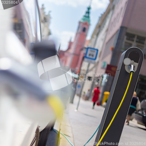 Image of Electric Car in Charging Station.