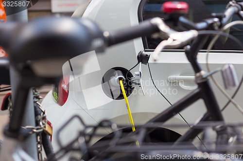 Image of Electric Car in Charging Station.