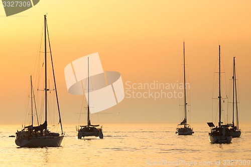 Image of Sailboats at sunset in Adriatic sea