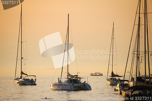 Image of Anchored sailboats at sunset in Adriatic sea