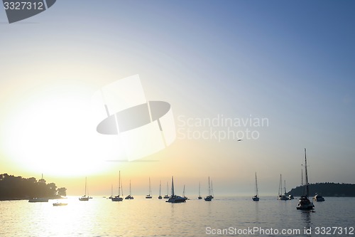 Image of Anchored sailboats at open sea