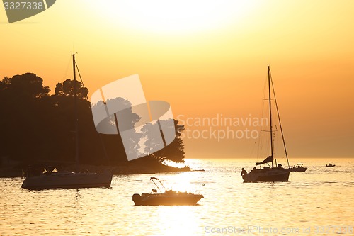 Image of Boats anchored at sunset