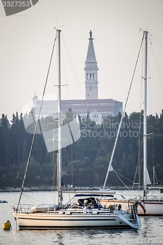 Image of Anchored boats in front of Saint Euphemia bell tower